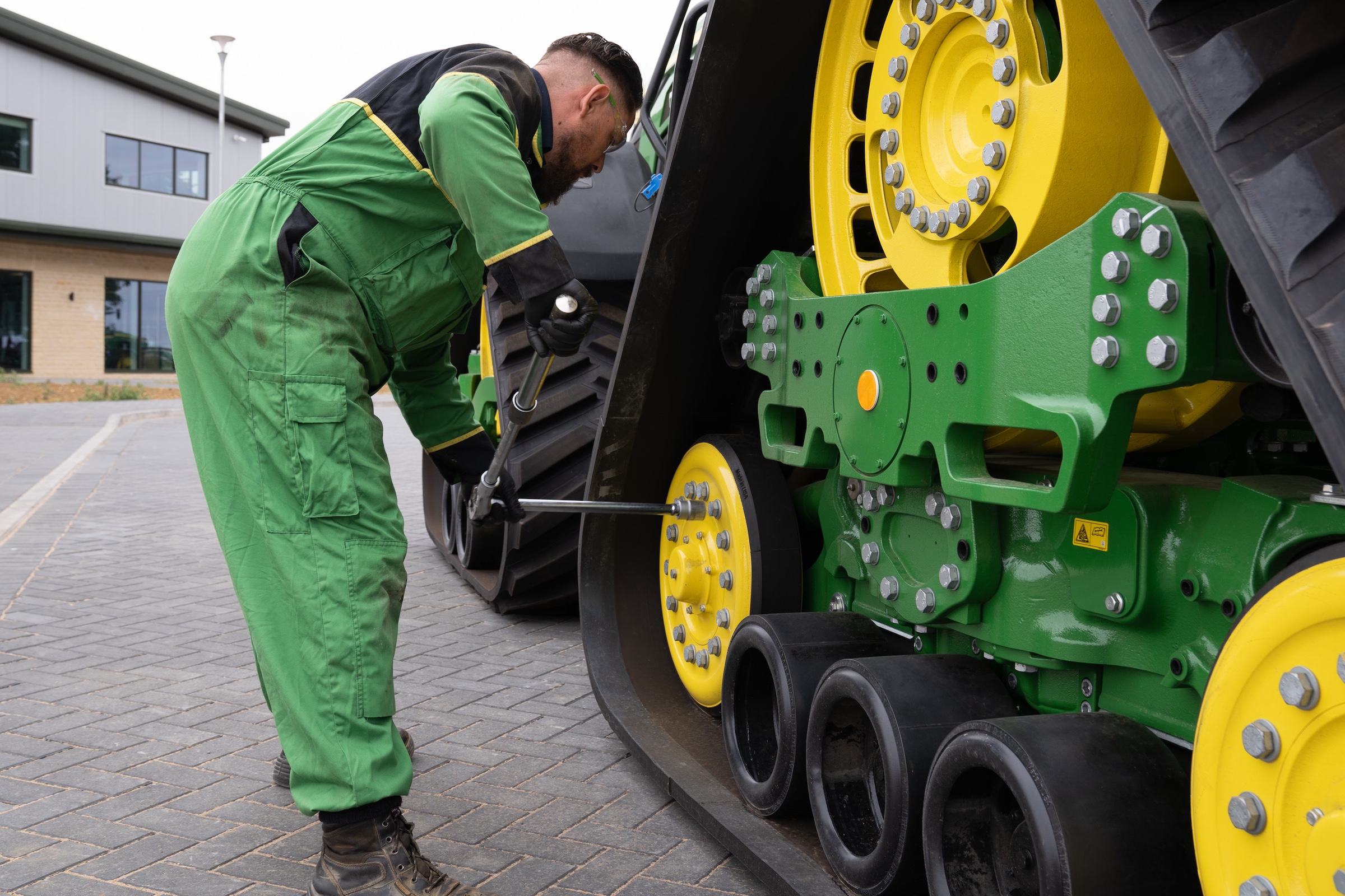 Working on a tracked john deere tractor